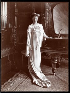 Portrait of Mrs. I. M. Clark standing by a piano, 1904